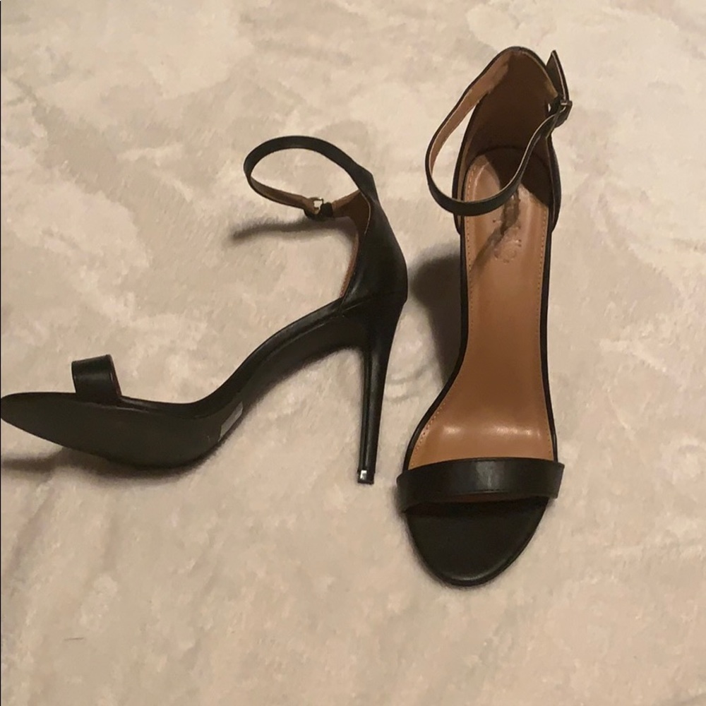 Black ankle strap heels.